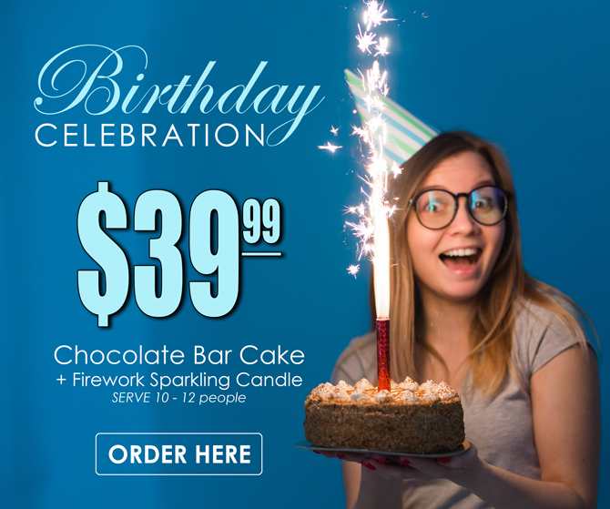 Girl holding a birthday cake with firework candle